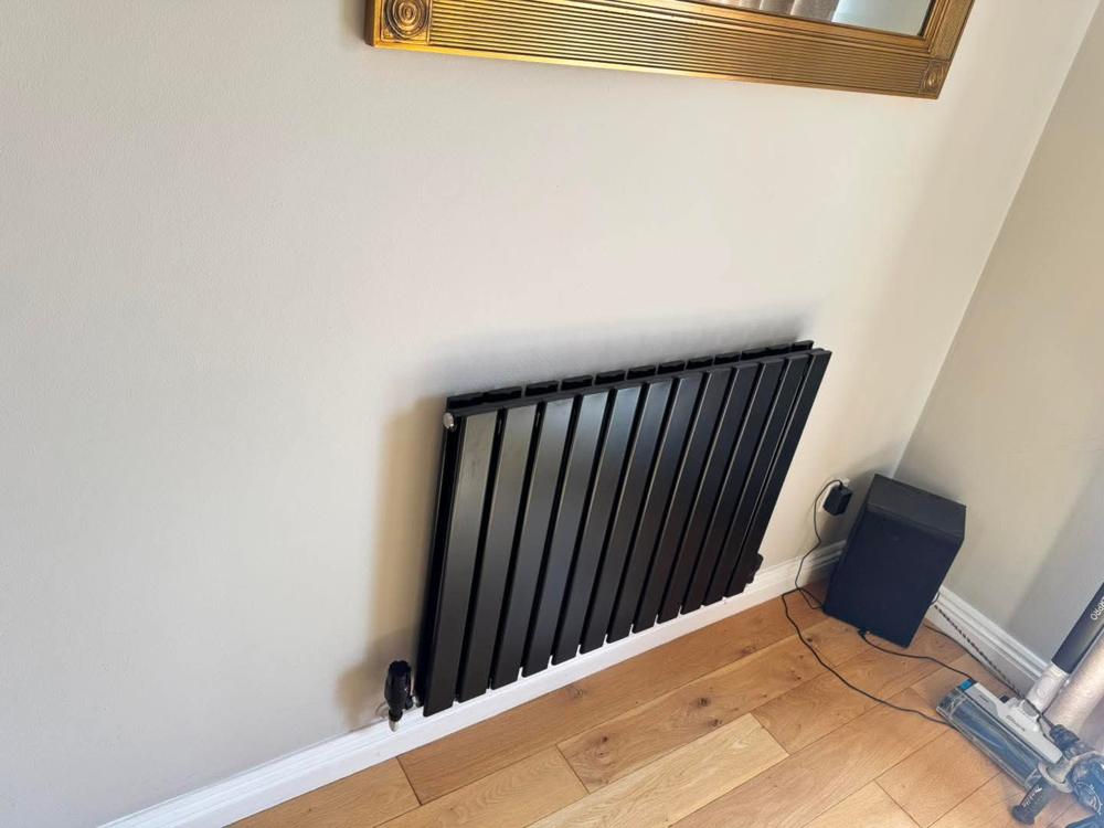 Designer radiator fitted in a living room